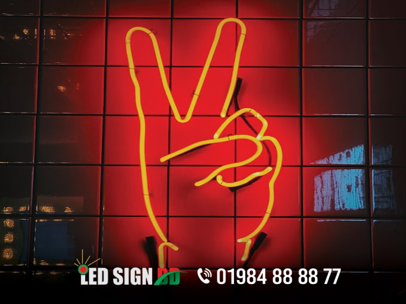 Neon Sign is the focus and major product of Led Sign Bd Ltd. Neon sign is an amazing home accessory and also ideal for business purposes to Advertising for your business. Do you want to create your own glow decoration that could enhance your own place or bring your party to the next level? Now customize your dream neon sign! It can be a lighting tool to light up your place, and a lovely decor for your salon, coffee shop, restaurant, bedroom, billboard, hospital, university, Name plate etc. Led Sign Bd Ltd is one of the best professional & leading Led signage companies in Dhaka Bangladesh Since 2006. The company has more than 18 years of experience in the Led signage sector. We have already completed many professional, attractive & challenging Led signage projects inside Dhaka and outside Dhaka. Neon Sign is our popular, best selling and major product. Already we completed 500+ neon sign project in inside Dhaka and outside Dhaka. The company goal is to provide premium quality and competitively priced led neon signage products for customers. We think that our rich experience in this field will help you respond to your customers. Neon Sign Now box-up emboss signage we can make it more creativity & good effect at the night scene. With the Neon Lighting, we provide the sign with few effects, example front lighting, shadow lighting, motion color lighting. Neon Sign, Cloud Led Neon Light Wall Light Wall Decor, Light Up Neon Sign for Bedroom, Kids Room, Bar, Party, Wedding etc. Led Sign bd Ltd offer expert advice and proven solutions tailored to suit your company’s individual neon sign needs. Led Sign Bd Ltd is the best neon sign company in Dhaka Bangladesh. We produce Glass Neon & import/assemble LED neon signage to create high quality business signs that make an impact. Let us light up your business with quality Neon/LED signage that will help you engage with your customer in a more delightful and aesthetic way. Neon Sign Board and Neon Lighting Signboard with Acp Board Branding For Indoor and Outdoor Signage.