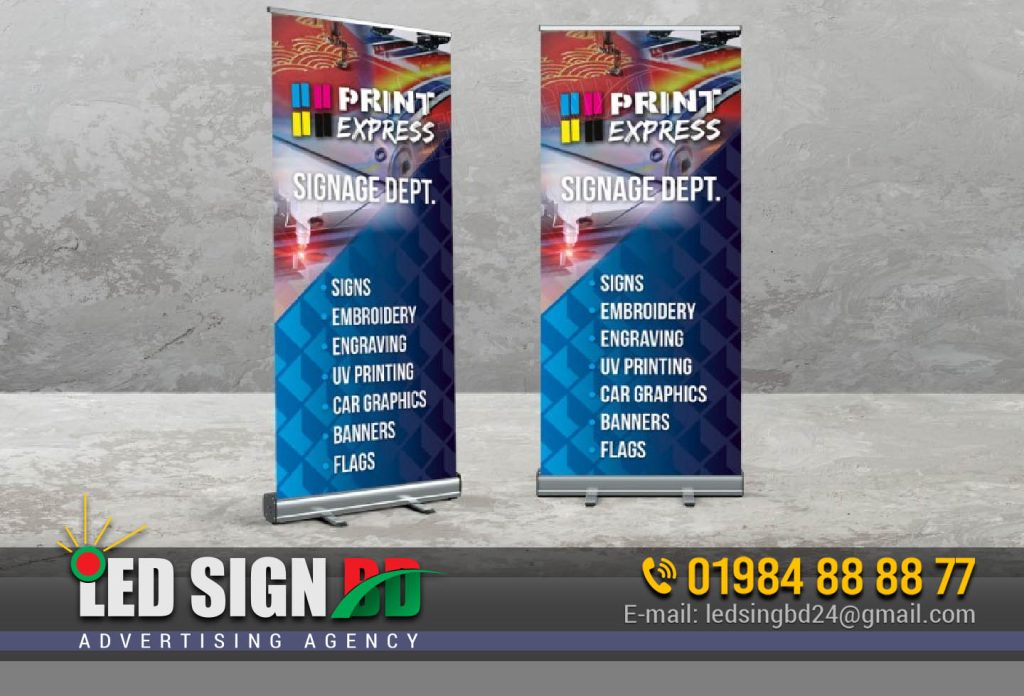 The Versatility of Roll up Banner Stands Roll up Banner Stands are commonly used in the Printing & Packaging industry, especially for Poster, Banner & Festoon displays. These stands are retractable, making them easy to transport and set up for various promotional events. Here are some key points to consider: 1. Compact Design The 24″ X 63″ size is perfect for businesses of all sizes. It offers ample space for your promotional content while remaining compact enough for easy handling and storage. Banner festoon Signage Agency Dhaka BD 2. High-Quality Printing The retractable roll up banner festoon signage board ensures that your message is displayed in high resolution and vibrant colors, grabbing the attention of passersby. 3. Cost-Effective With a price of BDT 1,850.00, Roll up Banner Stands are an affordable advertising solution, delivering significant value for your investment. Why Choose Custom Banner Stands? In Bangladesh, you can conveniently shop for custom banner stands online. Websites like Wrapup BD offer authentic easel/banner stands that can add a touch of class to your business display banners. They even provide home delivery, making it hassle-free for you to acquire these essential advertising tools. Signboard Billboard Nameplate Additional Features to Consider When selecting a Roll up Banner Stand, it’s essential to consider the following features: 1. Frame Material Most Roll up Banner Stands feature an aluminum alloy base, poles, and bottom legs. This ensures durability and stability during your promotional activities. 2. Weight and Size The weight of the stand varies, with some models weighing 1.75kg/set and others 1.85kg/set. The structure size typically measures 80x200cm, providing a generous display area. 3. Premium Quality For those seeking the utmost quality, Dhaka offers super premium quality X Banner Stands, priced at BDT 2,999.00. These stands are built to impress. Pop Up Stand Banner and X Stand If you’re looking for alternatives to Roll up Banner Stands, you can explore options like Pop Up Stand Banners with X Stands. These versatile banners, available for BDT 100.00, are suitable for both indoor and outdoor advertising in Bangladesh. Pull-Up Banner Stand and More Apart from Roll up Banner Stands and X Stands, you can also consider Pull-Up Banner Stands, Backdrop Banner Stands, and Pole Stands for your promotional needs. Prices range from 2,500Tk to 12,000Tk, ensuring there’s an option for every budget. Roll Up Banner Stands: The Conclusion In conclusion, Roll up Banner Stands are a fantastic addition to your marketing arsenal. They are versatile, cost-effective, and visually appealing. Whether you’re promoting products, services, or events, these stands can help you make a strong impression. Frequently Asked Questions What is the typical size of a Roll up Banner Stand? Roll up Banner Stands are available in various sizes, but a popular choice is 24″ X 63″ due to its versatility. Are Roll up Banner Stands suitable for outdoor use? While Roll up Banner Stands can be used outdoors, they are more commonly used indoors for trade shows, exhibitions, and events. Can I customize the graphics on a Roll up Banner Stand? Yes, you can customize the graphics on a Roll up Banner Stand to match your branding and promotional needs. How do I set up a Roll up Banner Stand? Roll up Banner Stands are easy to set up. Simply extend the banner from the base and attach it to the supporting pole. Where can I purchase Roll up Banner Stands in Bangladesh? X-Stand Pop-Up and Roll-Up Banner Price Bangladesh. You can buy Roll up Banner Stands online from reputable sellers like wrapup BD or visit local printing and advertising shops. Invest in a Roll up Banner Stand today to elevate your business’s promotional efforts and leave a lasting impression on your target audience.