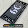 A black and white acrylic house number nameplate